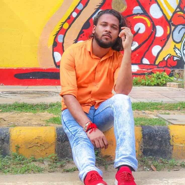 Kaveri Mehta, Lead Design Curator at Root Prism Leaf, reviewing corporate floral arrangements